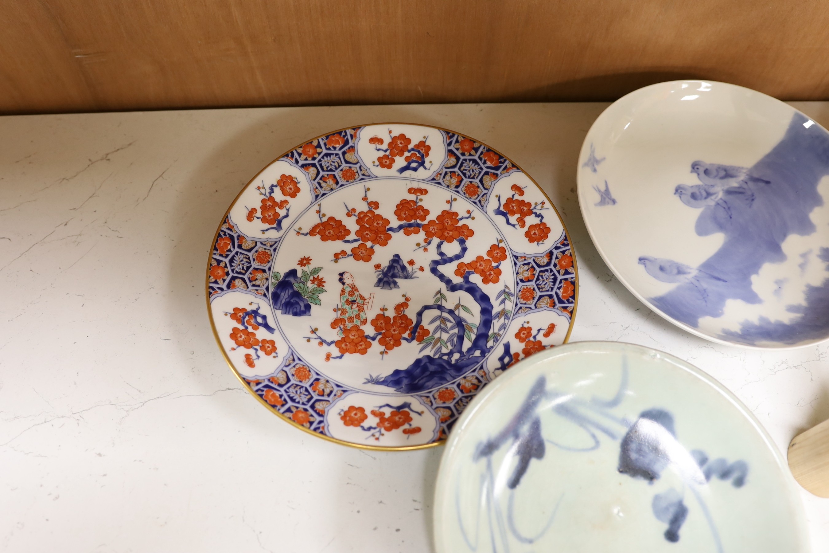 A group of Chinese plates and dishes including a Ming dynasty blue and white bowl